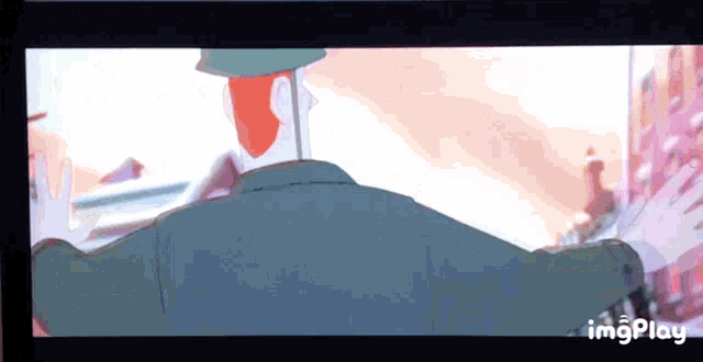 a cartoon of a man with red hair is being displayed on a screen with the words imgplay at the bottom