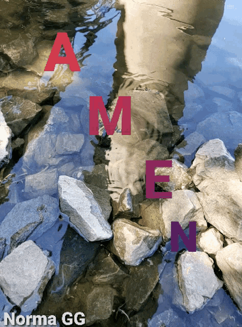 the word amen is written on a rock in the water