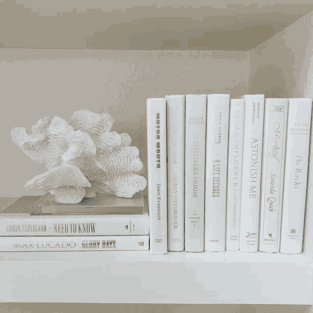 a book titled glory days sits on a white shelf with other books