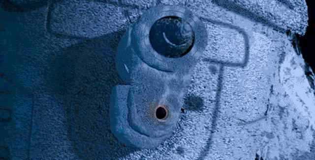 a blue object with a hole in the middle of it
