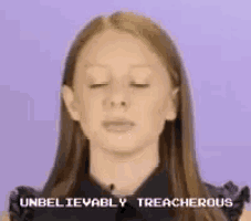 a woman is making a funny face and the words unbelievably treacherous are on the screen behind her
