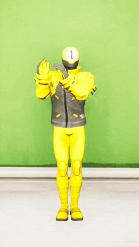 a person in a yellow suit with the number 1 on their head