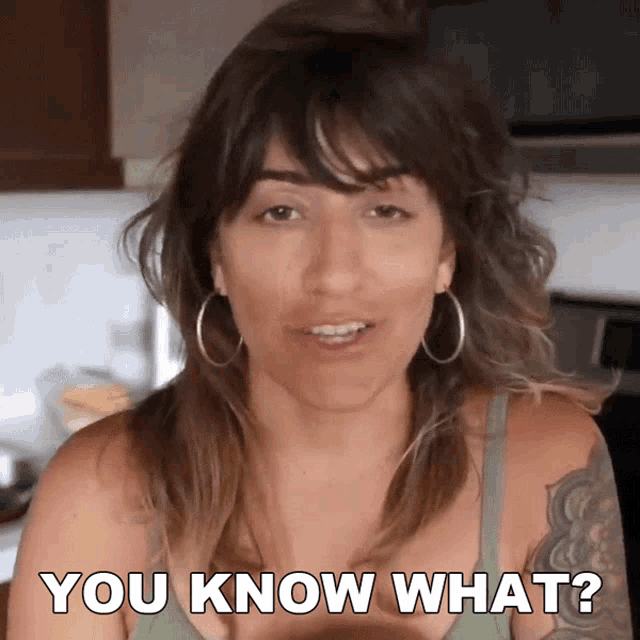 a woman with a tattoo on her arm says " you know what "