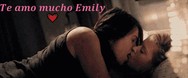 a woman kissing another woman with the words te amo mucho emily above them