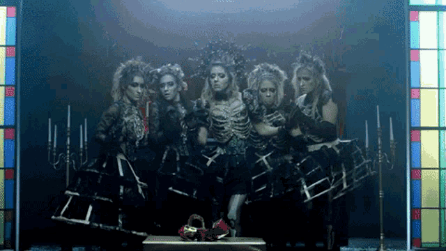 a group of women are dressed in skeleton costumes