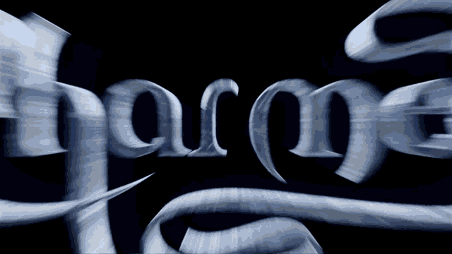 a blurry image of the word harmony on a dark background