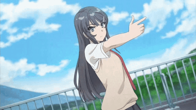 a girl giving a thumbs up while standing on a balcony