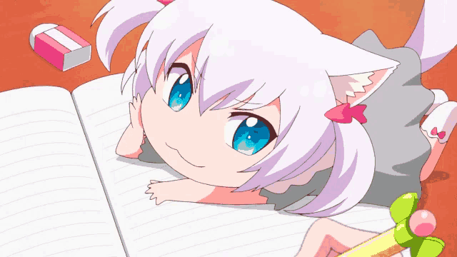 a little girl with a cat ear is laying on a table with a notebook and pencil