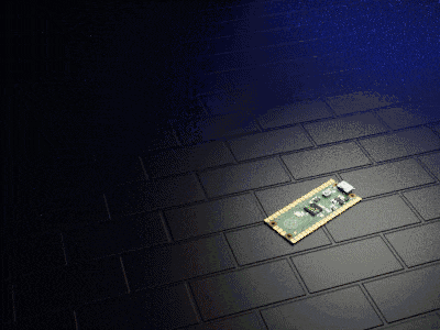 a small motherboard is laying on a black tile floor