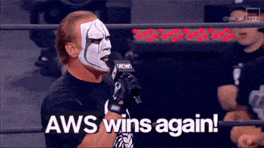 a wrestler with aws wins again written on the bottom of his face