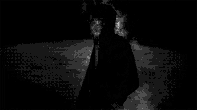 a black and white photo of bubbles coming out of the water .