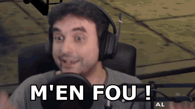 a man wearing headphones says m ' en fou !