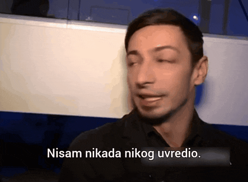 a man in a black shirt says nisam nikada nikoga uvedio