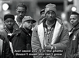 a group of men are standing next to each other on a city street .