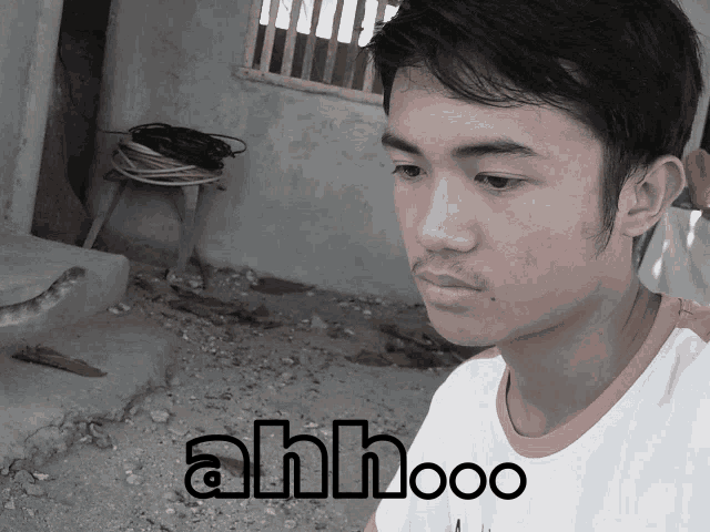 a picture of a young man with the words ahh ooo on the bottom