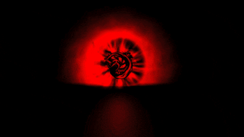a black background with a red glowing circle in the middle