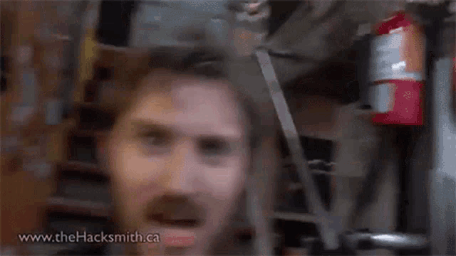 a man with a beard is making a funny face and says `` i guess i have to '' .