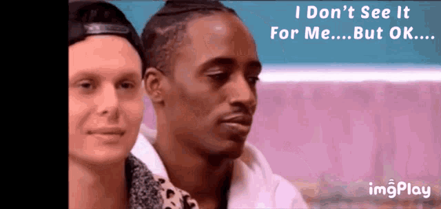 two men are sitting next to each other and the caption says " i don 't see it for me ... but ok "