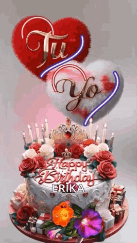 a birthday cake with flowers , candles , and a heart on top of it .