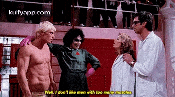 a group of people are standing next to each other in a room and one of them is talking about men with too many muscles .