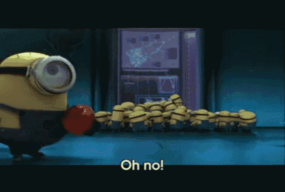a group of minions are standing in a room and one of them is holding a boxing glove and says oh no