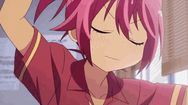 a girl with pink hair has her eyes closed and her hand in her hair