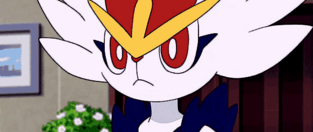 a close up of a cartoon character with red eyes and a yellow crown