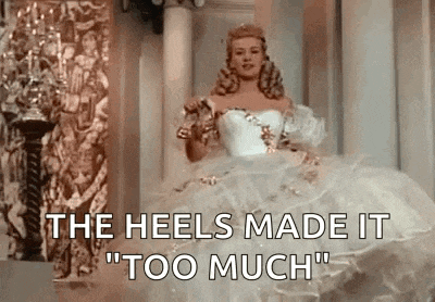a woman in a white dress is standing in a room with the words `` the heels made it '' too much .