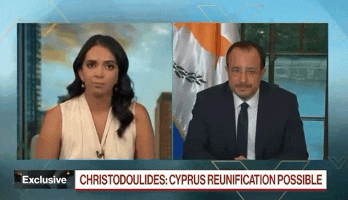 a man and a woman are talking on a television screen with the words exclusive at the top
