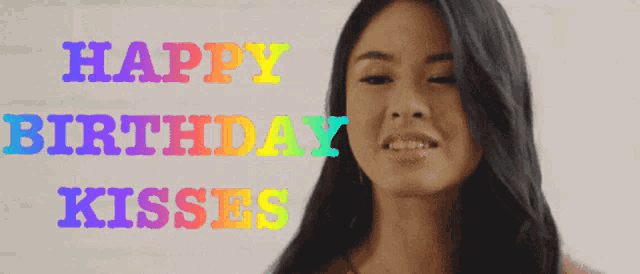 a woman is smiling with the words happy birthday kisses above her