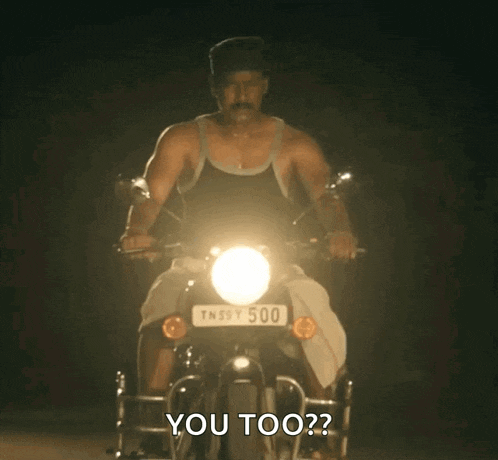a man riding a motorcycle with a license plate that says tn39y500