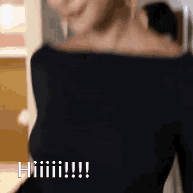 a woman in a black off the shoulder top is smiling and says hiiiiii !!!
