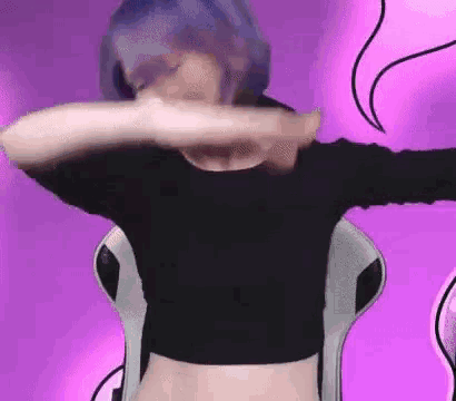 a woman with blue hair is sitting in a chair with her arms outstretched and a purple background .