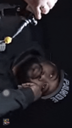 a man wearing a hat that says pound on it is laying down