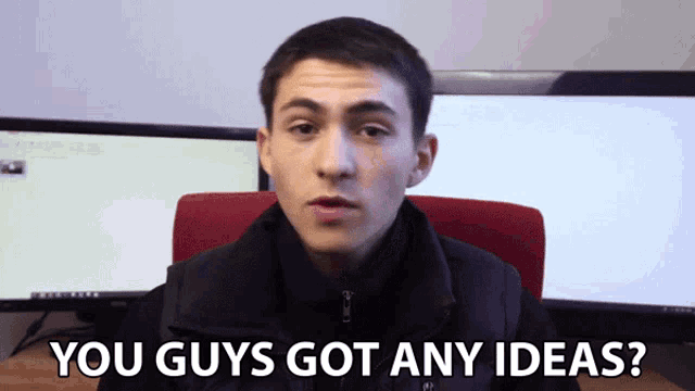a man says you guys got any ideas in front of a computer monitor