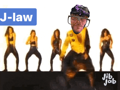 a group of women are dancing in front of a sign that says ' j-law '