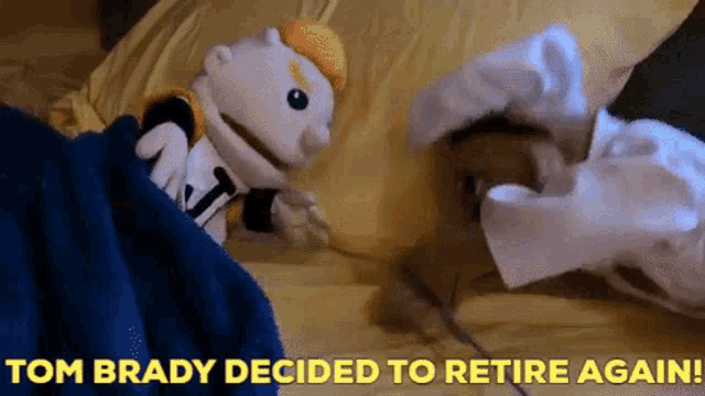 a puppet is laying on a bed with the words tom brady decided to retire again written above it
