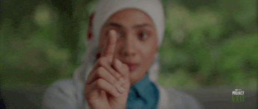 a person covering their mouth with their hands with the words project exit on the bottom left