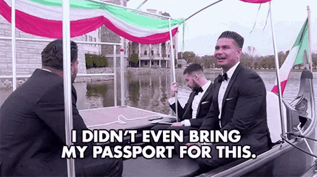 a group of men in tuxedos are riding a gondola .