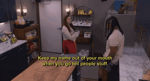 a man and a woman are talking in a kitchen and the woman says " keep my name out of your mouth when you go tell people stuff