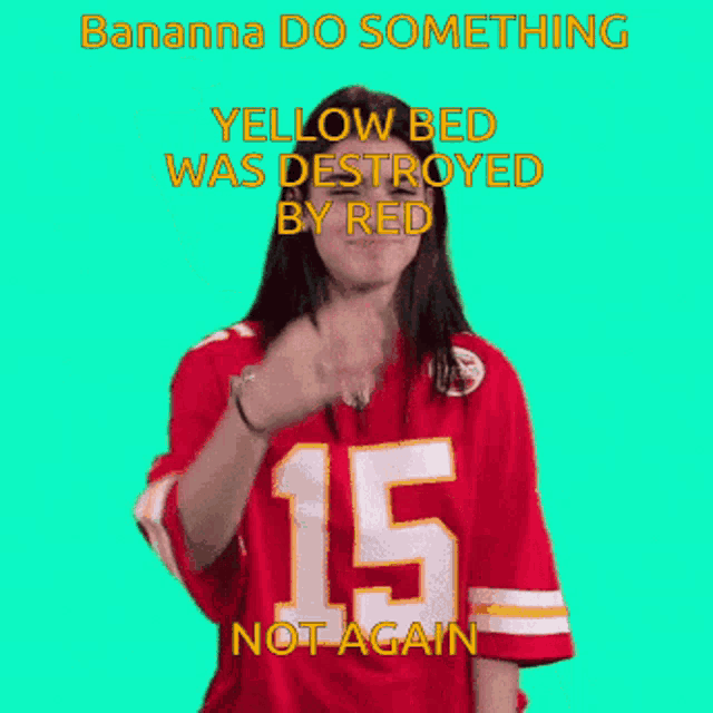 a woman wearing a red jersey with the number 15 waves her hand