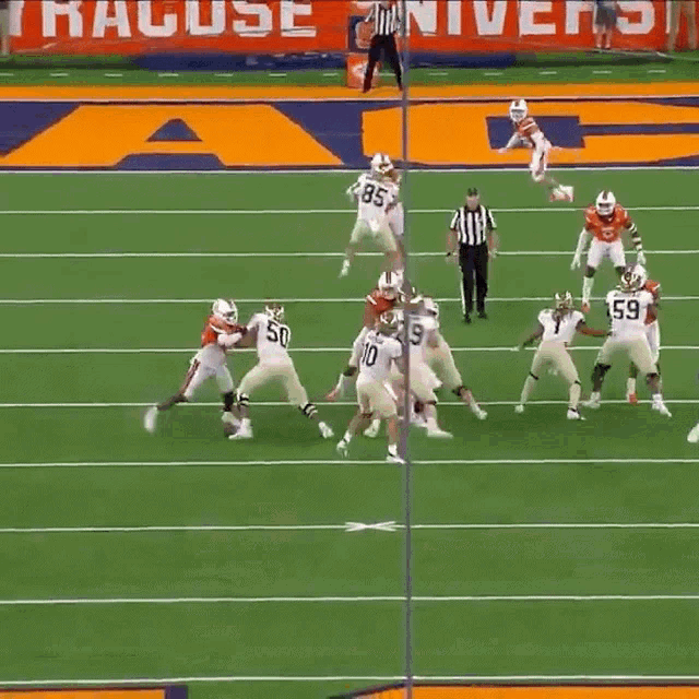 a football game is being played on a field with a large y on the sidelines