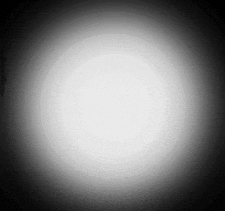 a black and white photo of a white circle