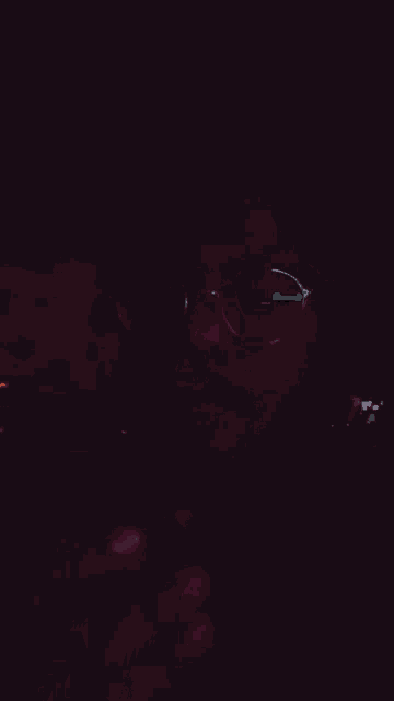 a man wearing glasses is smoking a pipe