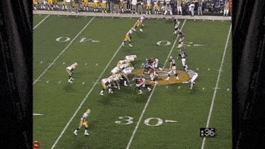 a football game is being played on a field with the number 30 on it