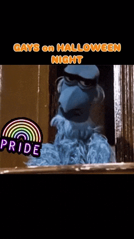 a sesame street character says gays on halloween night with a rainbow in the background