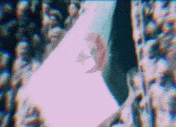 a blurry picture of a person 's face with a purple background
