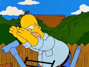 homer simpson is covering his face with his hands while sitting on a ladder .