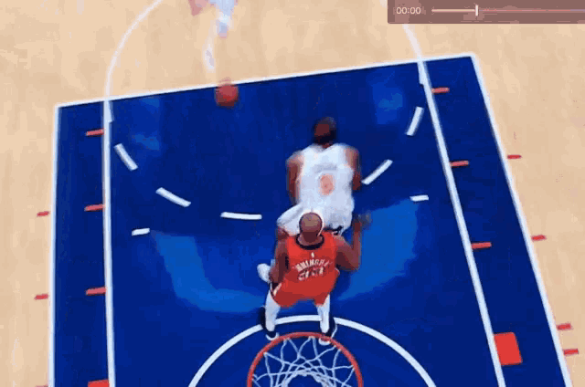 a basketball game is being played on a court with a clock showing 0:01