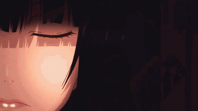 a close up of a woman with her eyes closed